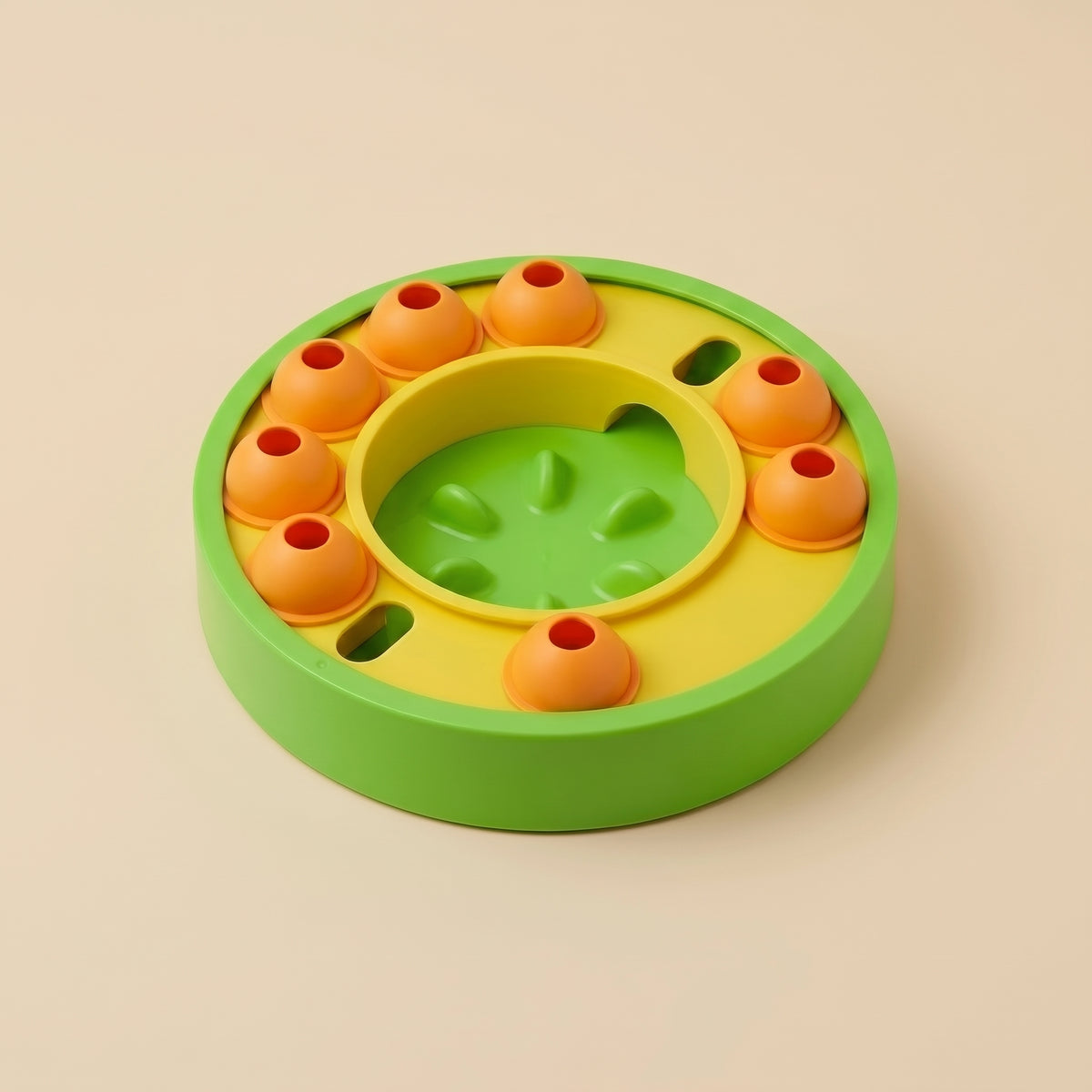 Green slow feeder puzzle bowl for cats and small dogs, studio shot on cream background